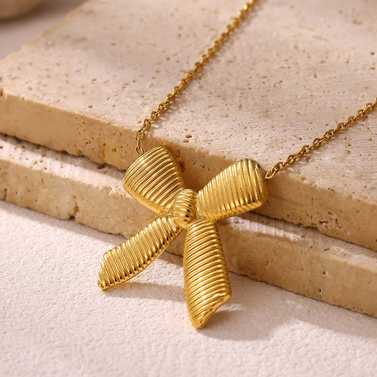 c2b7505c-c1f4-4a3a-be6d-09be025b6983.jpg EternaGlow Geometric Bow Necklace – Tarnish-Free Luxury Statement Jewelry - Image 1